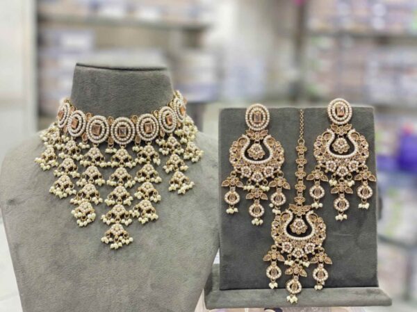 The beautiful white transparent stones clearly arranged, embossed vibrant colorful polki beads stringed by the pearls